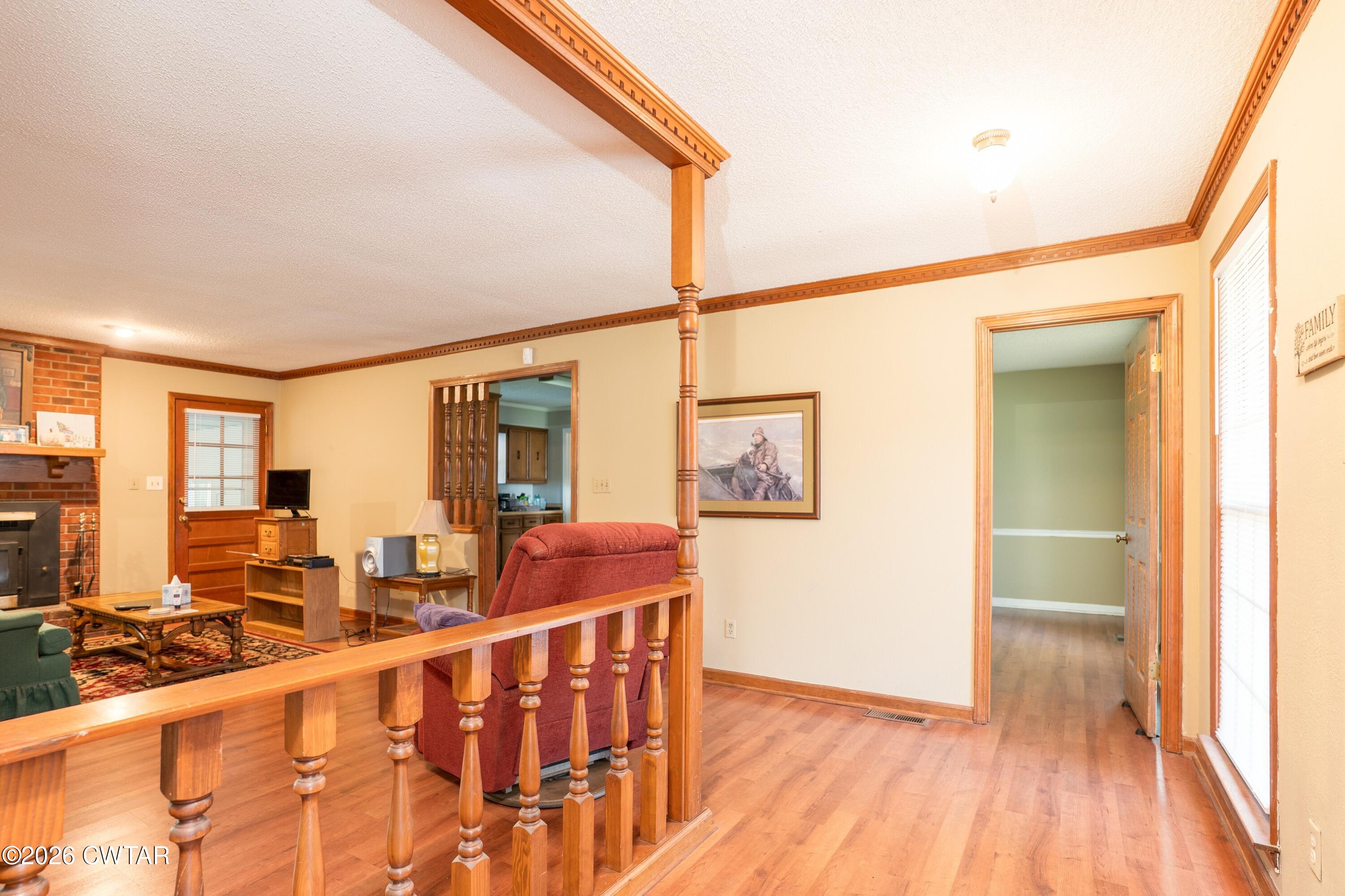 1053 Ashport Road Jackson, TN 38305 - Photo 17 of 42 a view of a living room with furniture and wooden floor