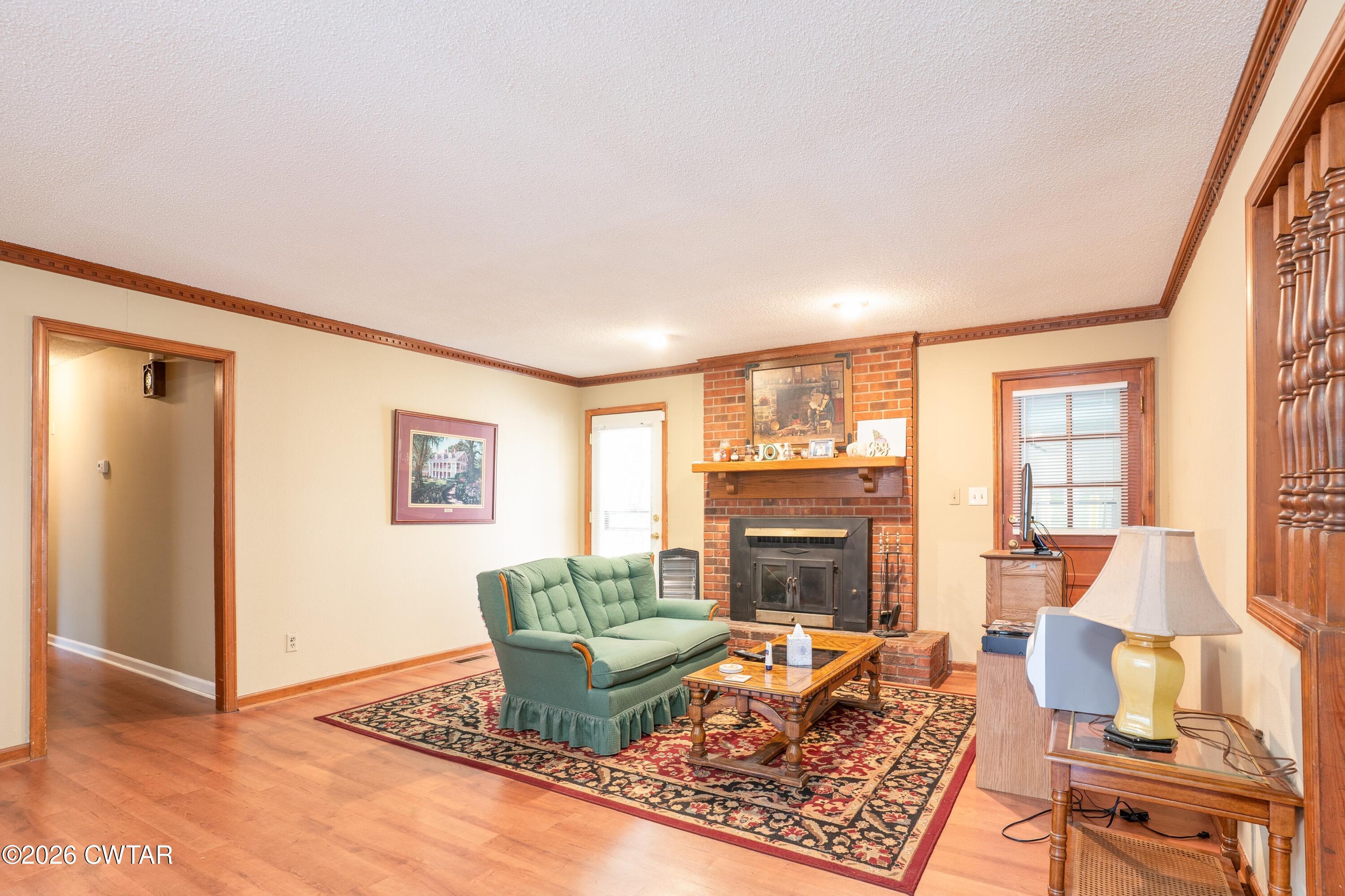 1053 Ashport Road Jackson, TN 38305 - Photo 18 of 42 a living room with furniture and a fireplace