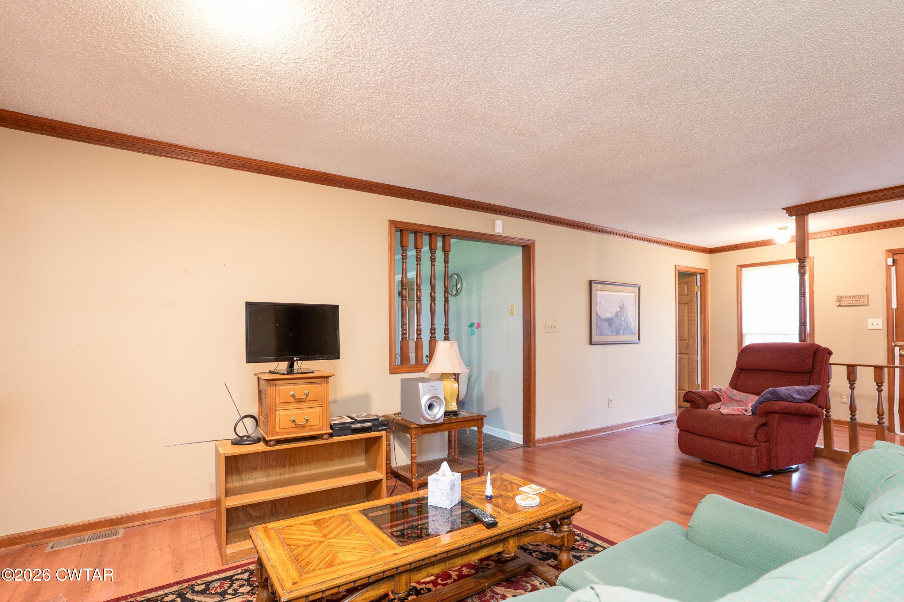 1053 Ashport Road Jackson, TN 38305 - Photo 20 of 42 a living room with furniture and a flat screen tv