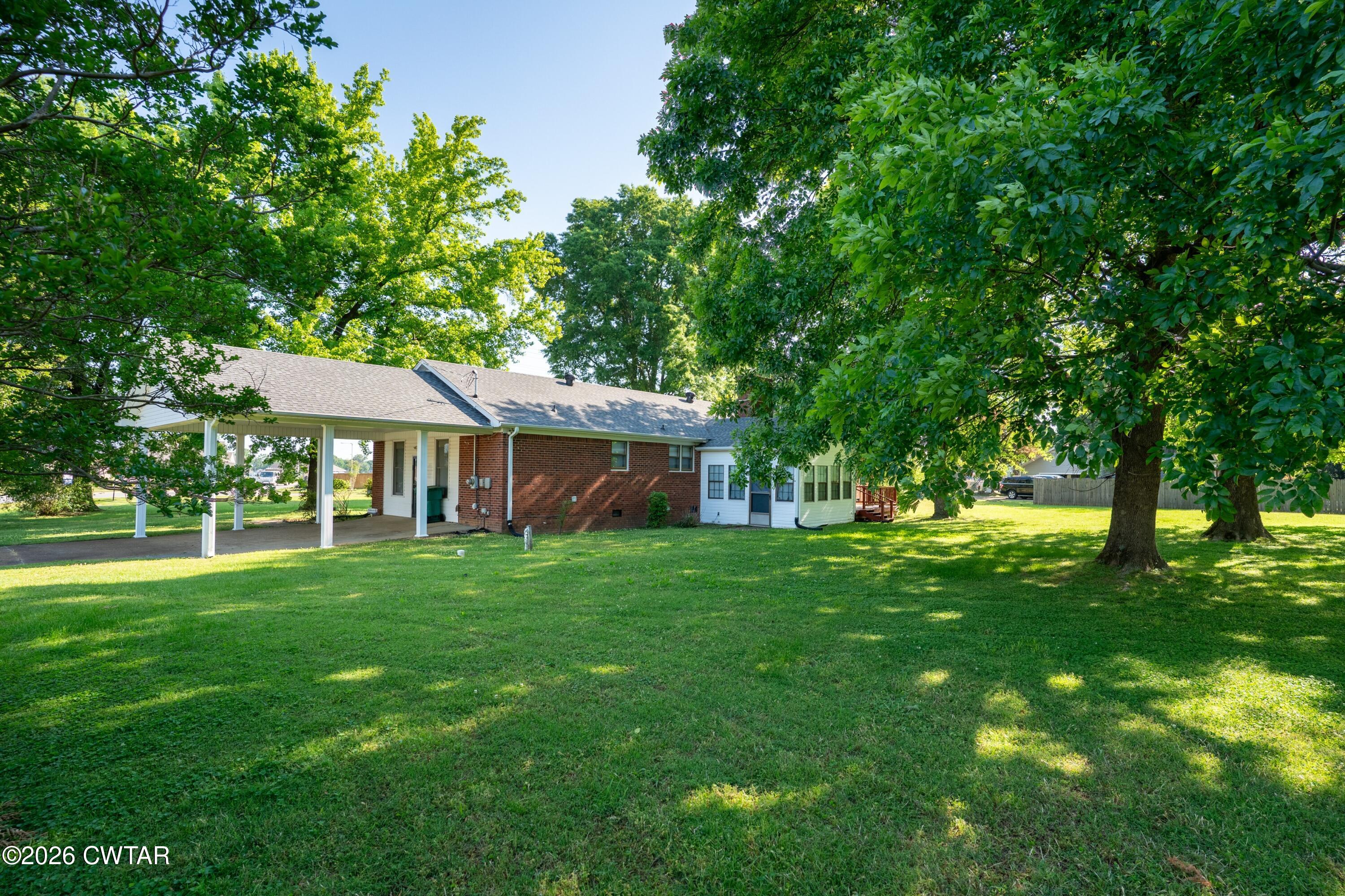 1053 Ashport Road Jackson, TN 38305 - Photo 2 of 42 a view of a house with a backyard
