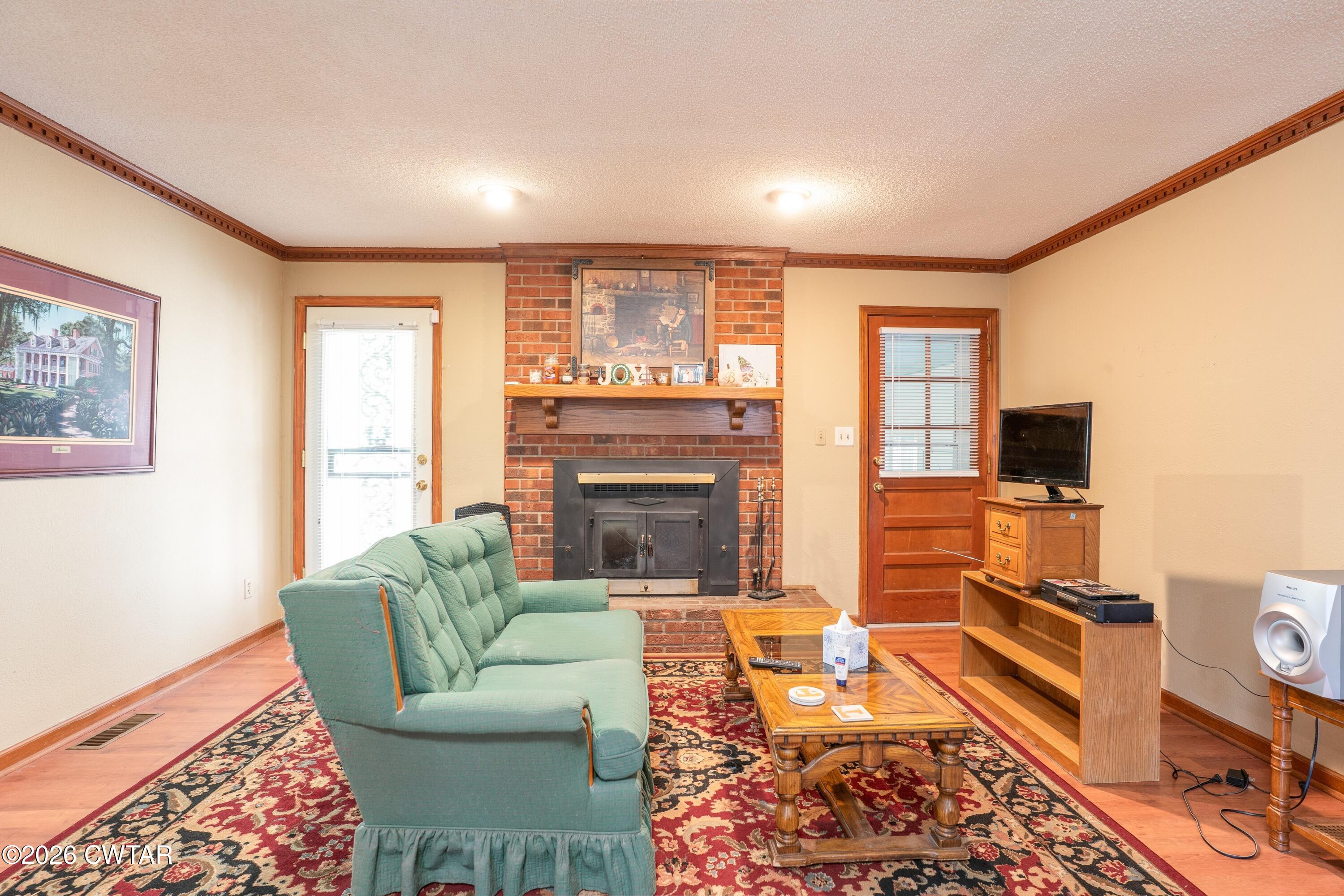 1053 Ashport Road Jackson, TN 38305 - Photo 22 of 42 a living room with furniture and a fireplace