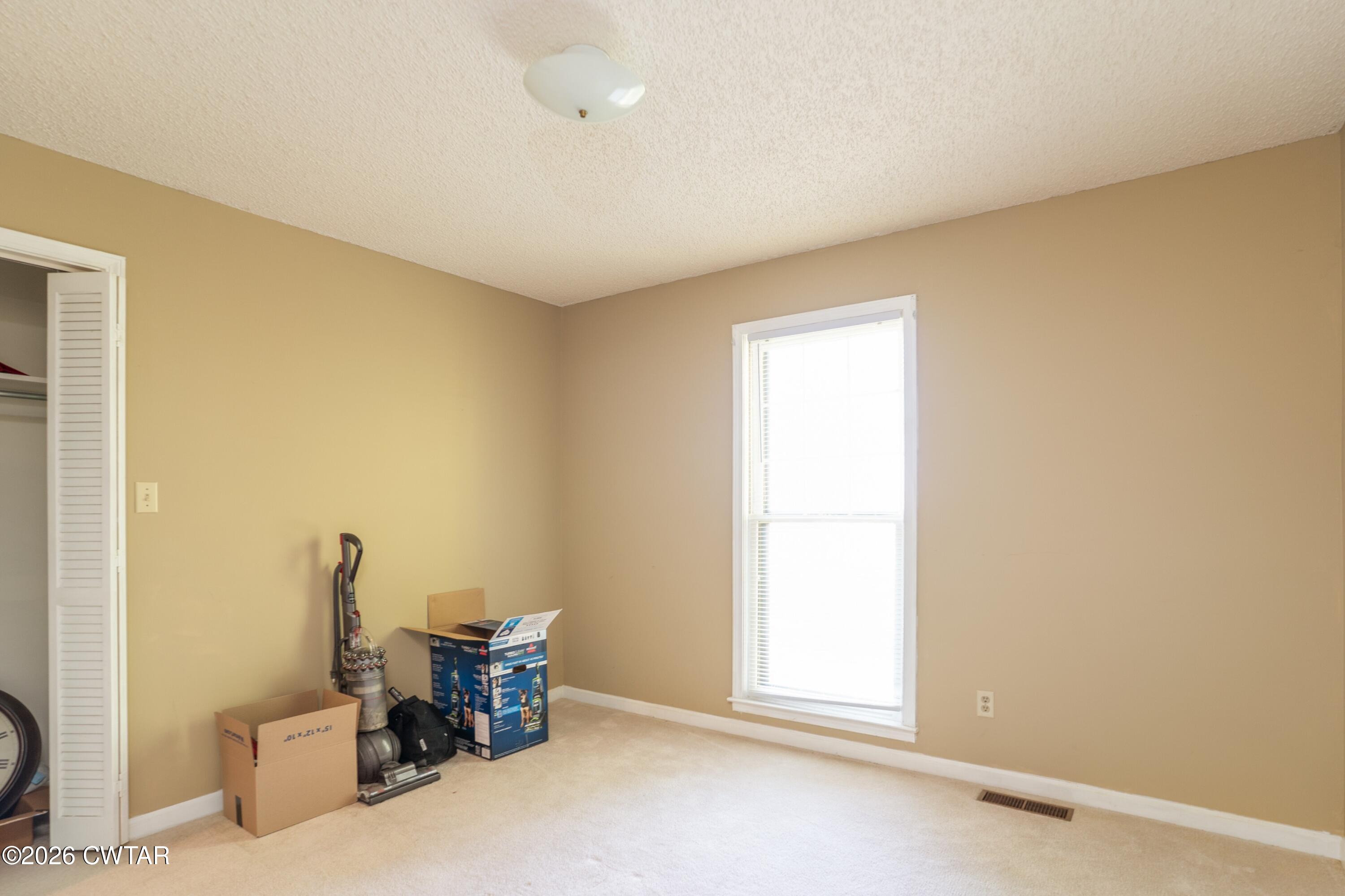 1053 Ashport Road Jackson, TN 38305 - Photo 33 of 42 a view of a room with furniture and windows
