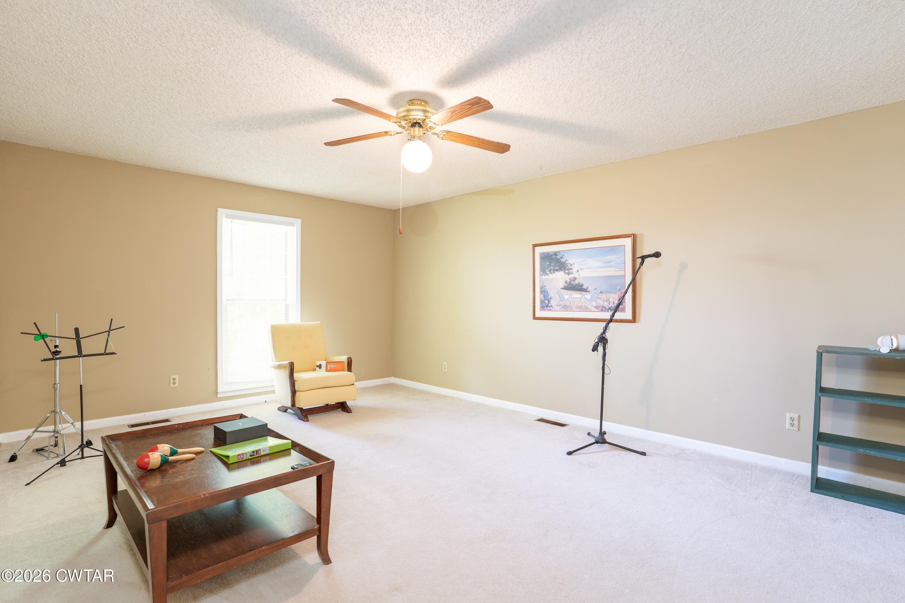 1053 Ashport Road Jackson, TN 38305 - Photo 38 of 42 a living room with furniture and a window