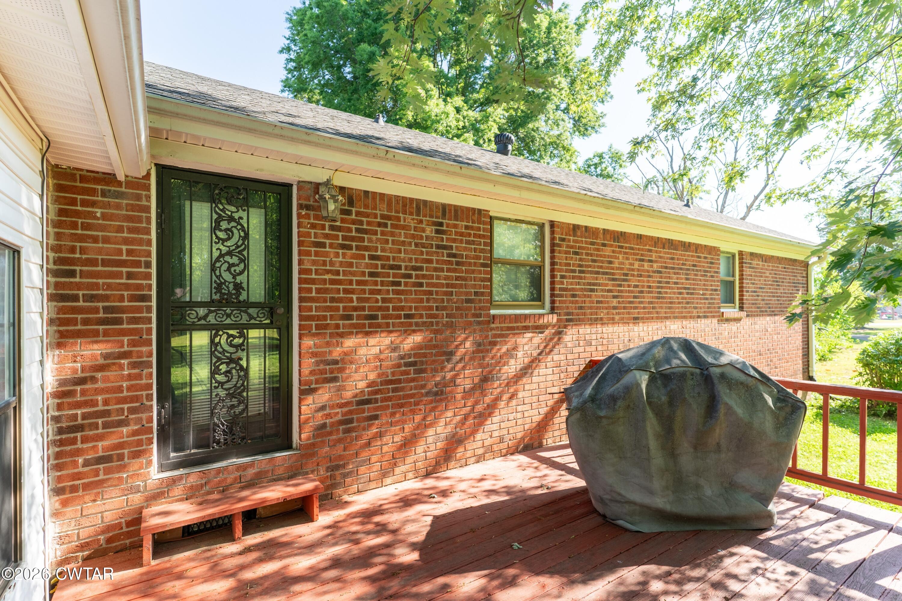 1053 Ashport Road Jackson, TN 38305 - Photo 6 of 42 a view of a small house with roof