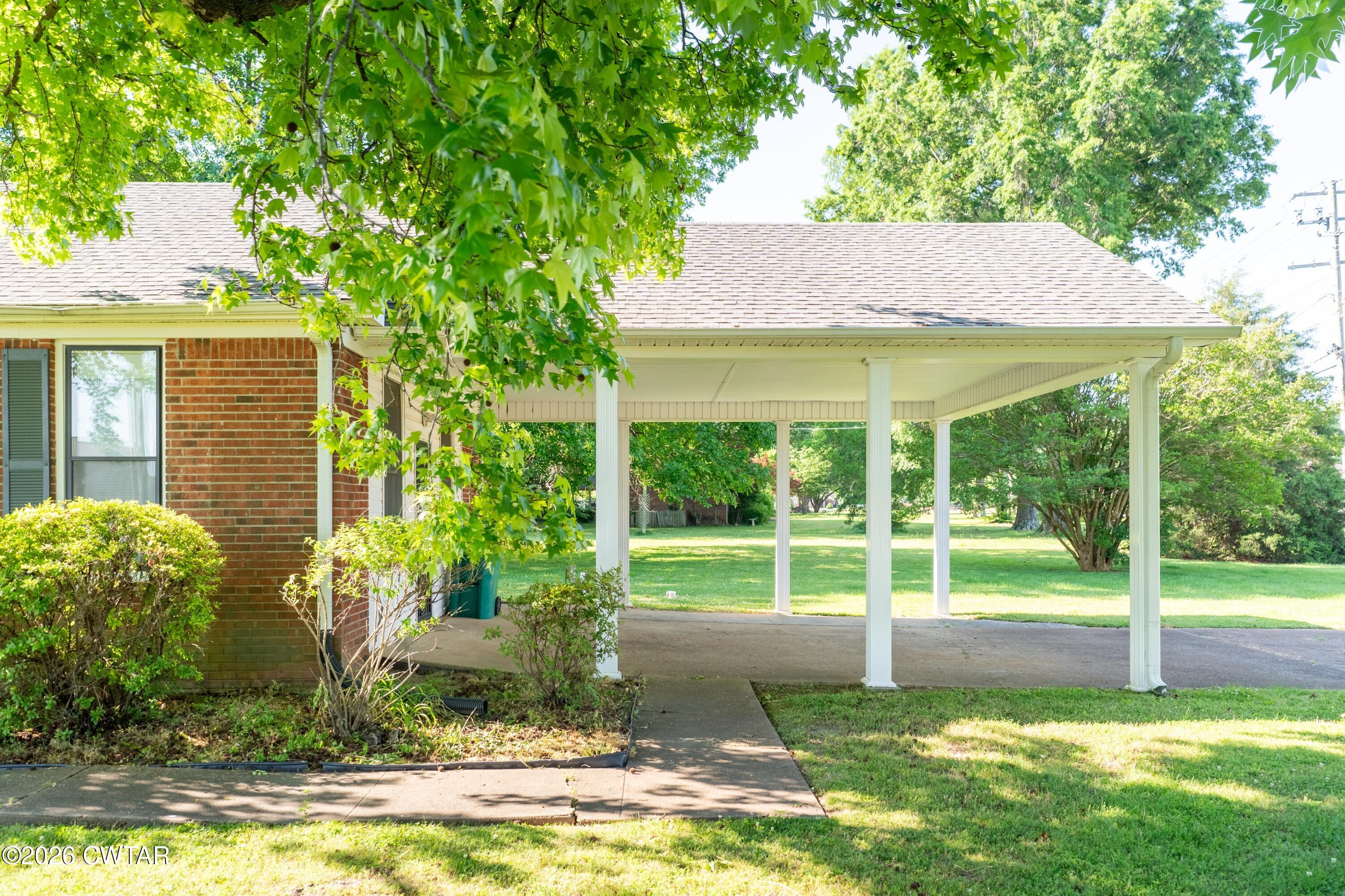 1053 Ashport Road Jackson, TN 38305 - Photo 9 of 42 a view of a house with backyard and sitting area