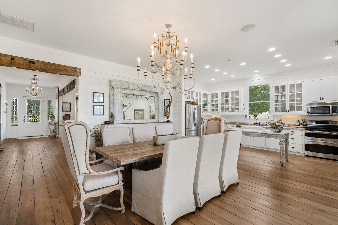 5025 Wickel Road Burton, TX 77835 - Photo 11 of 50 a living room with furniture and a chandelier