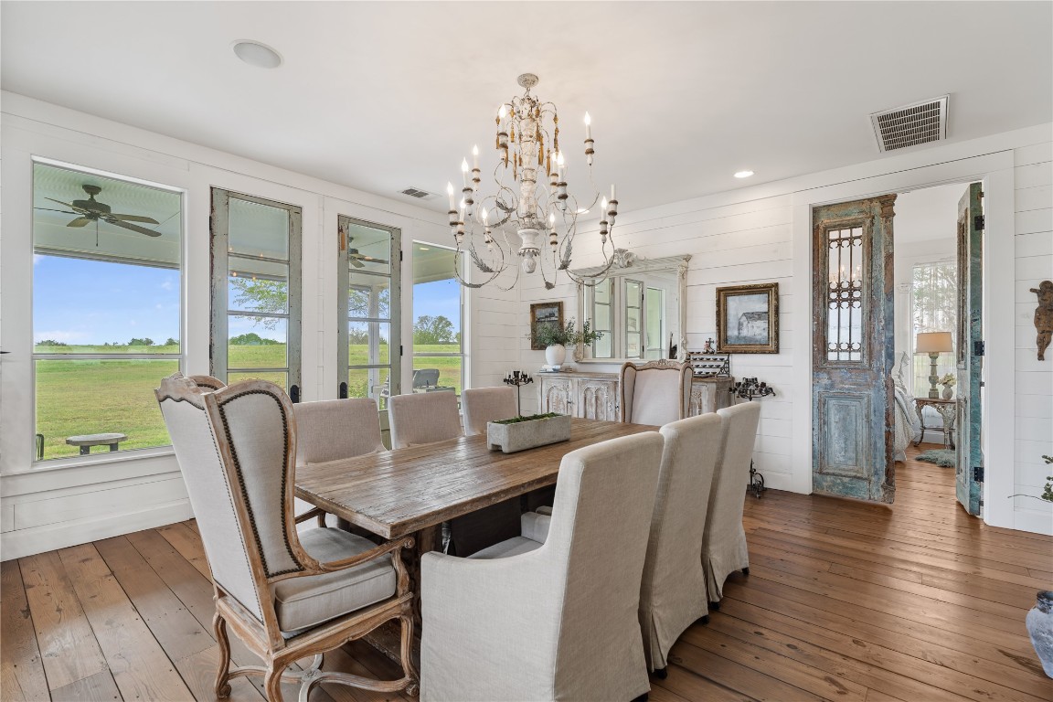 5025 Wickel Road Burton, TX 77835 - Photo 12 of 50 a view of a dining room with furniture window and wooden floor