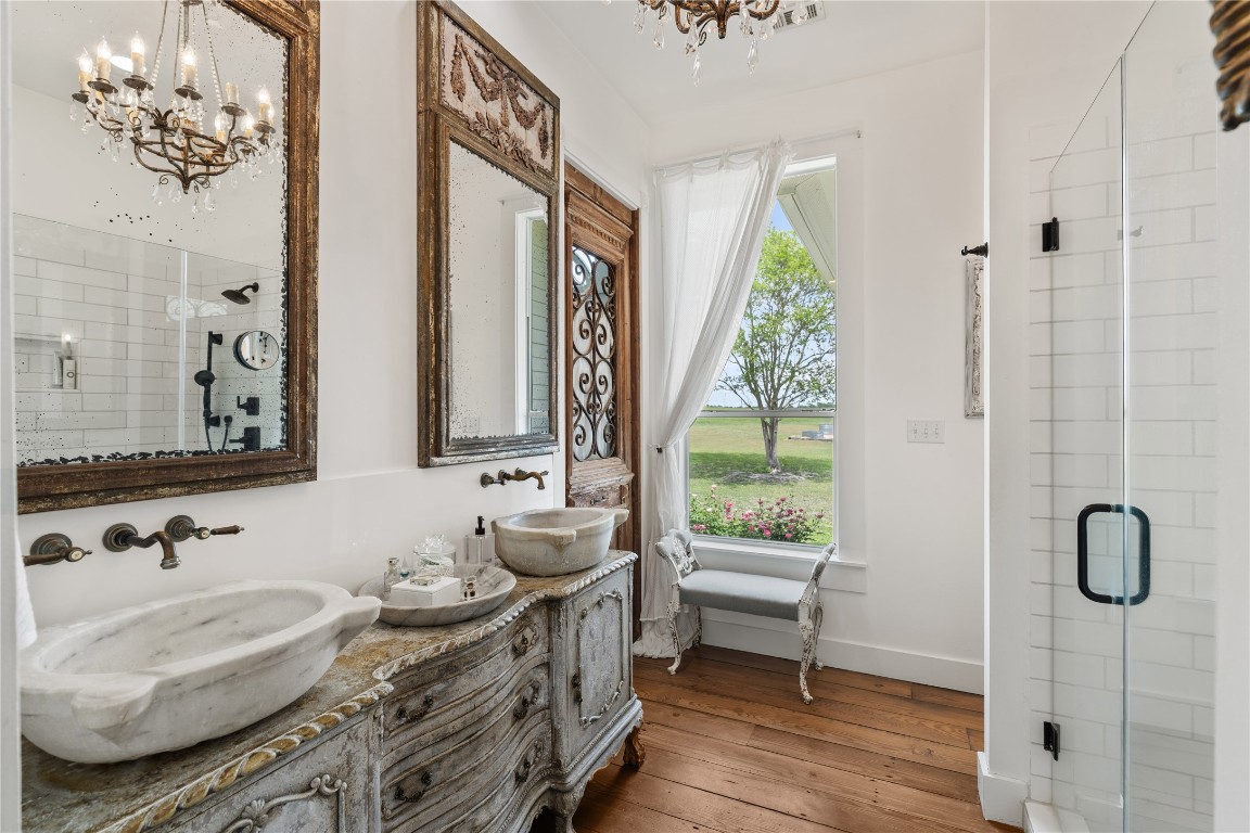 5025 Wickel Road Burton, TX 77835 - Photo 16 of 50 a bathroom with a granite countertop sink and a window