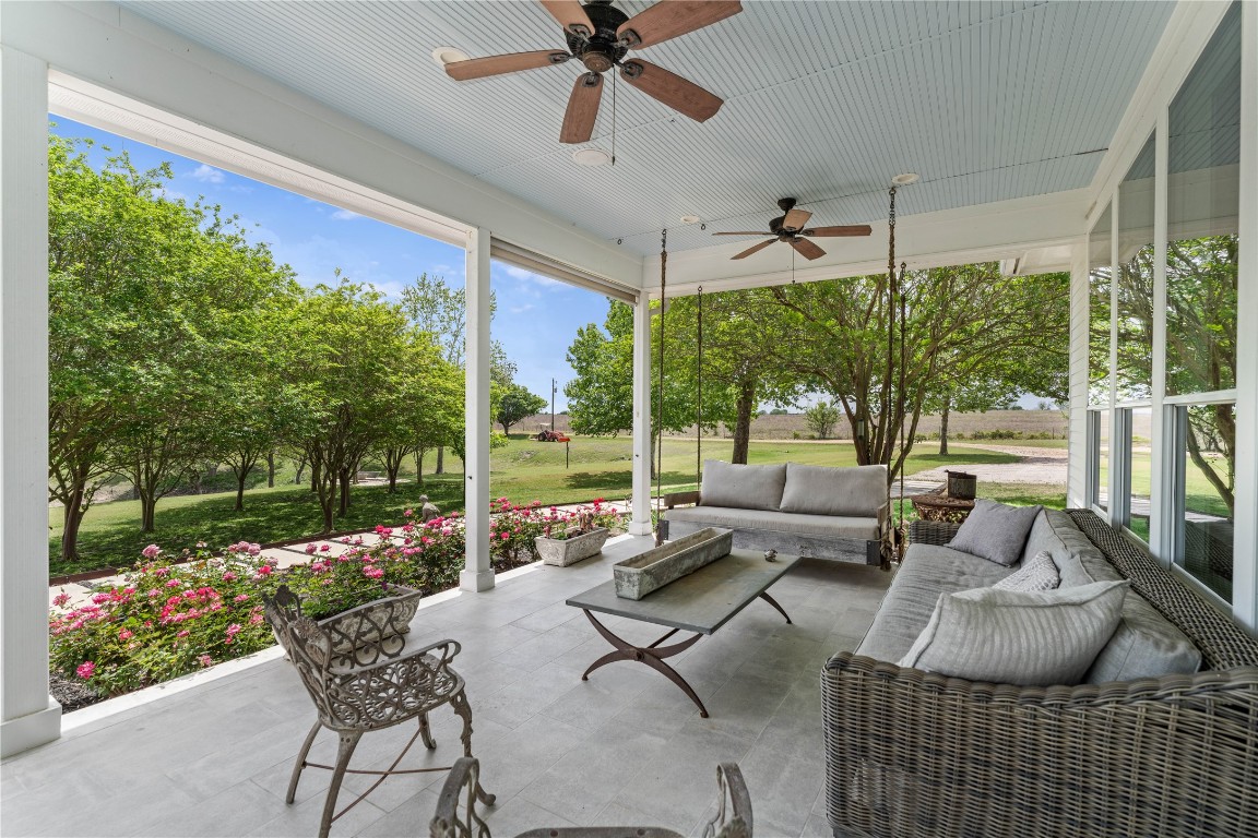 5025 Wickel Road Burton, TX 77835 - Photo 8 of 50 a living room with patio furniture and a garden