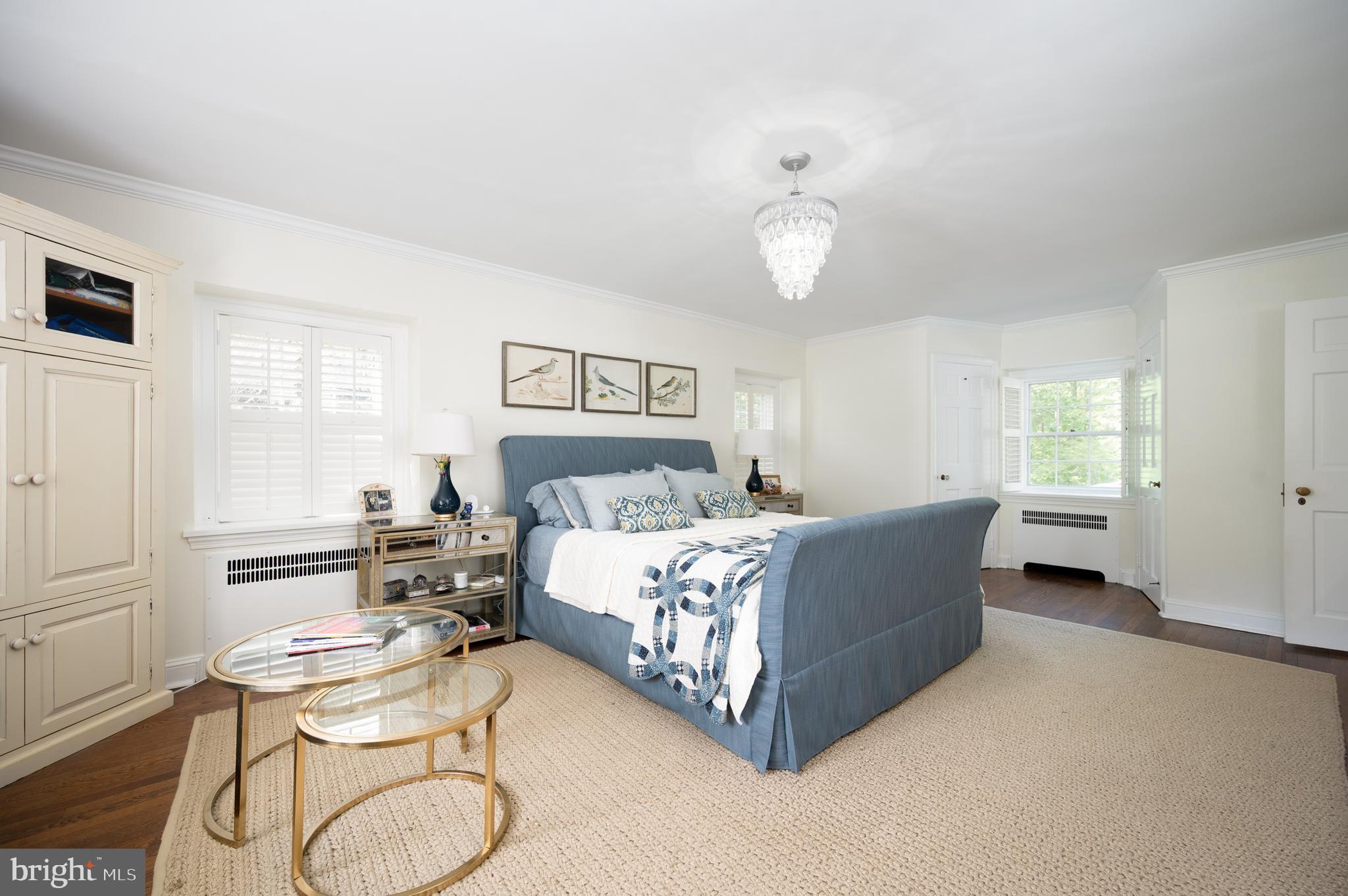 907 Overbrook Road Wilmington, DE 19807 - Photo 11 of 25 a bedroom with a bed and a chandelier