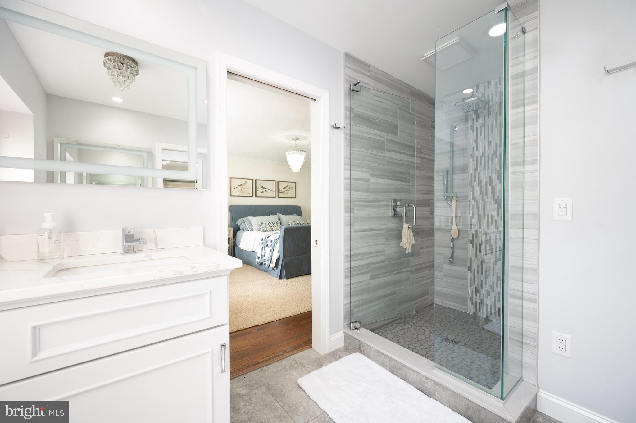 907 Overbrook Road Wilmington, DE 19807 - Photo 12 of 25 a bathroom with a shower a sink and a mirror