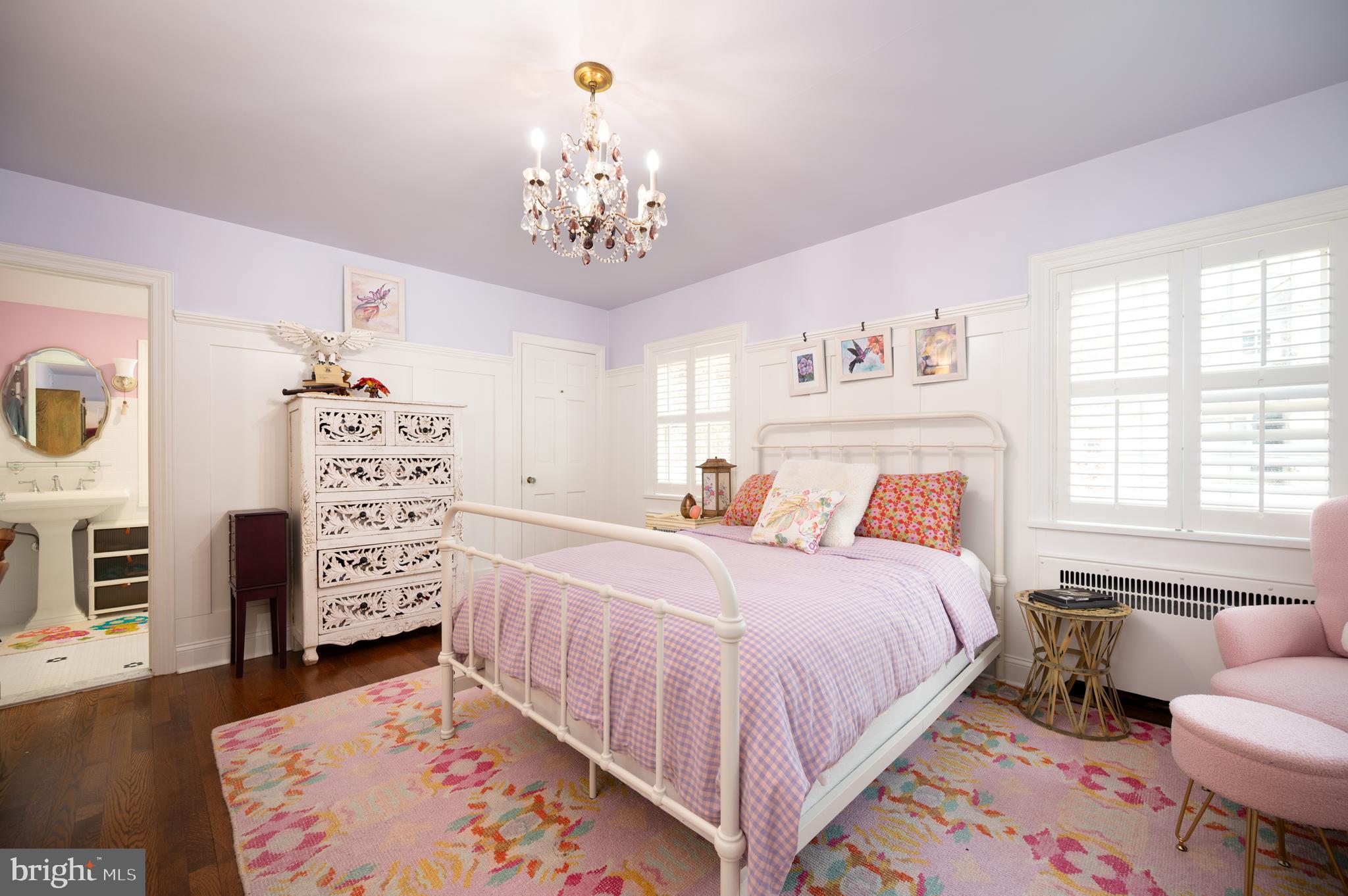 907 Overbrook Road Wilmington, DE 19807 - Photo 14 of 25 a bedroom with a bed chandelier and a window