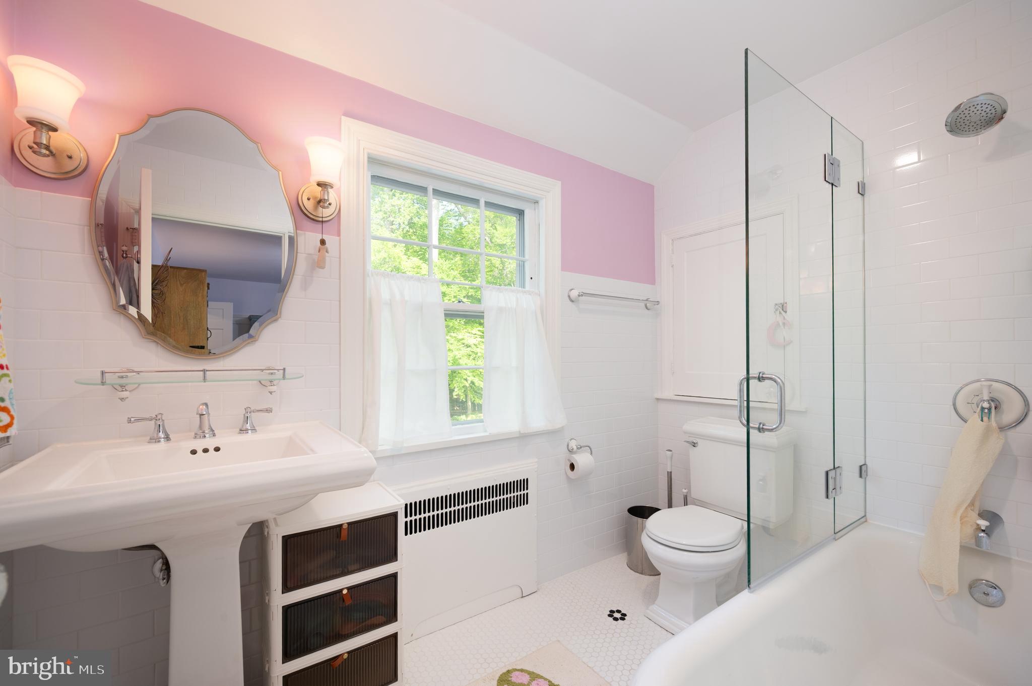 907 Overbrook Road Wilmington, DE 19807 - Photo 16 of 25 a bathroom with a sink vanity granite toilet and a mirror