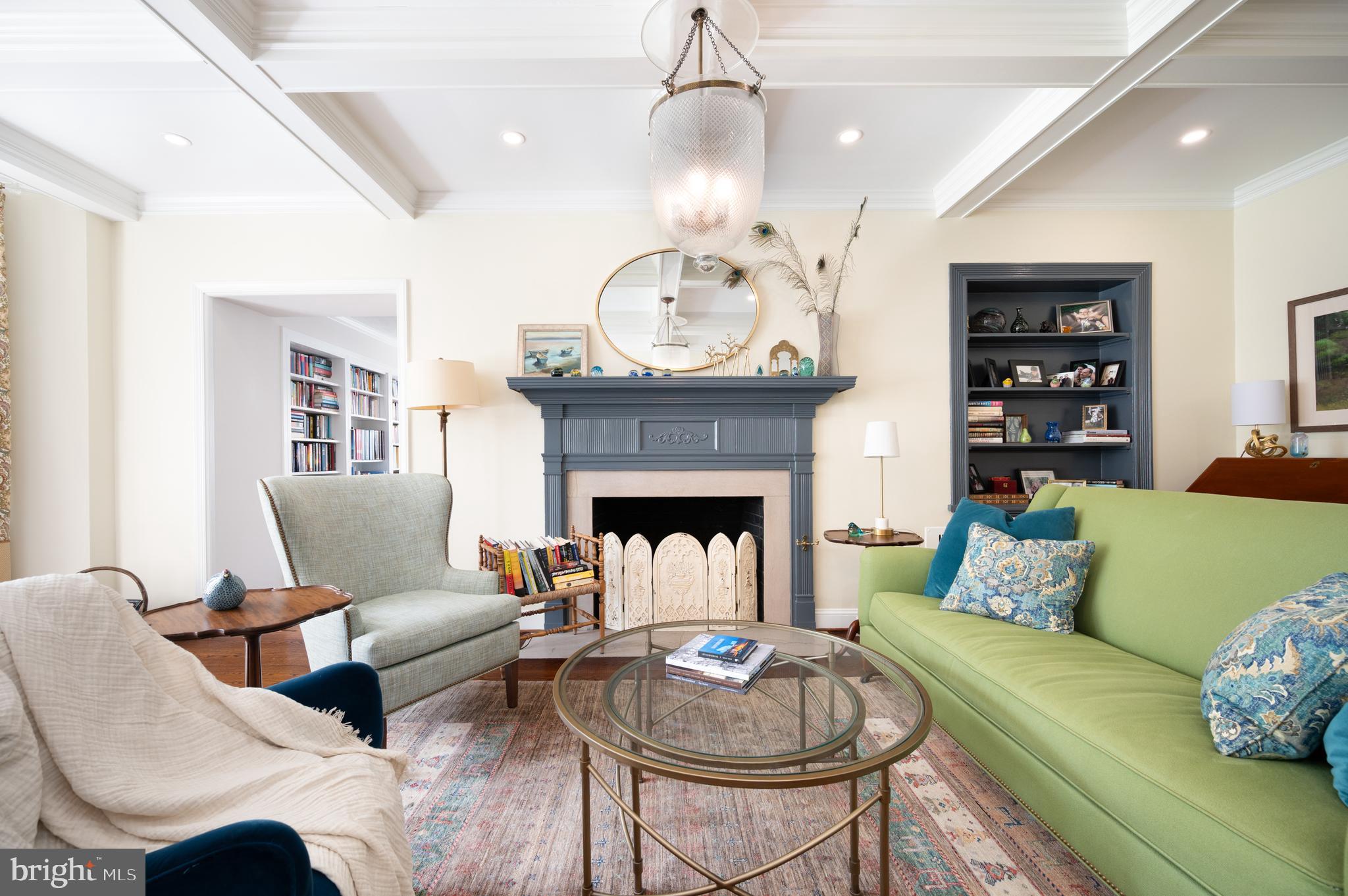 907 Overbrook Road Wilmington, DE 19807 - Photo 2 of 25 a living room with furniture a fireplace and a chandelier