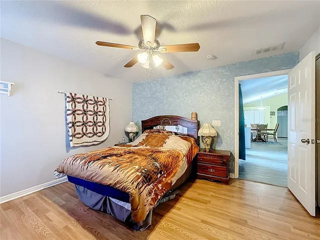 a bedroom with a bed and a dresser