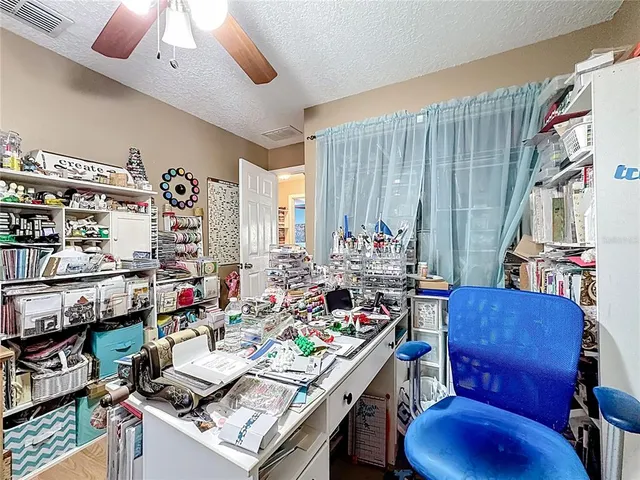 a bathroom with a sink a toilet and shower curtain