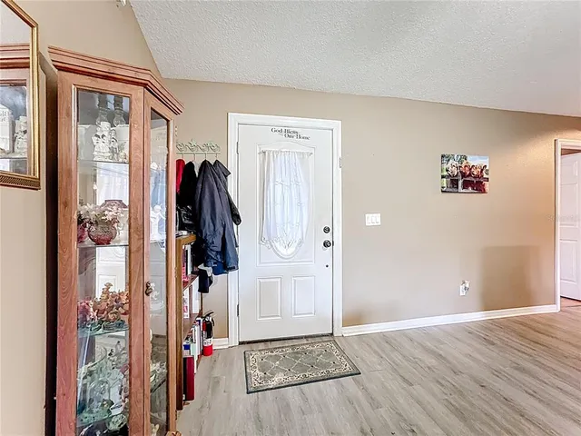 a view of a livingroom with wooden floor and closet