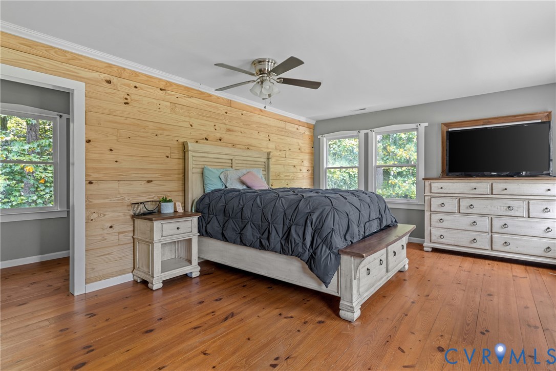 80 Mill Ridge Road Hartfield, VA 23071 - Photo 14 of 43 Wood-finish flooring, wood-paneled accent wall, ce
