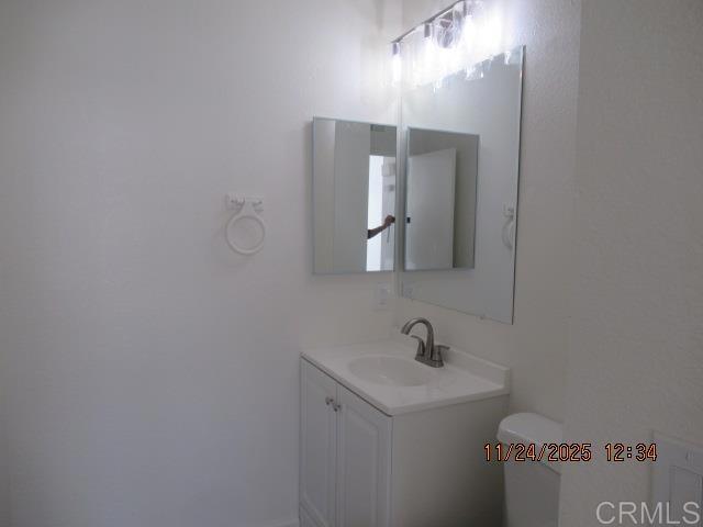 935 Redbud Road Chula Vista, CA 91910 - Photo 5 of 8 a bathroom with a sink and a mirror