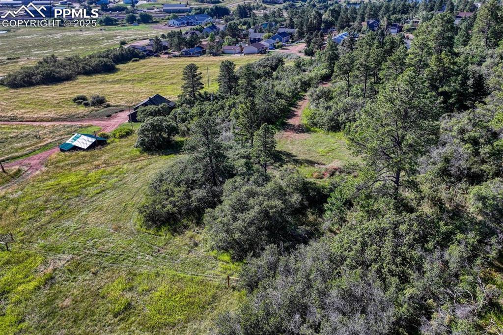 0 Columbine Road Palmer Lake, CO 80133 - Photo 28 of 37 an aerial view of residential houses with outdoor space and trees