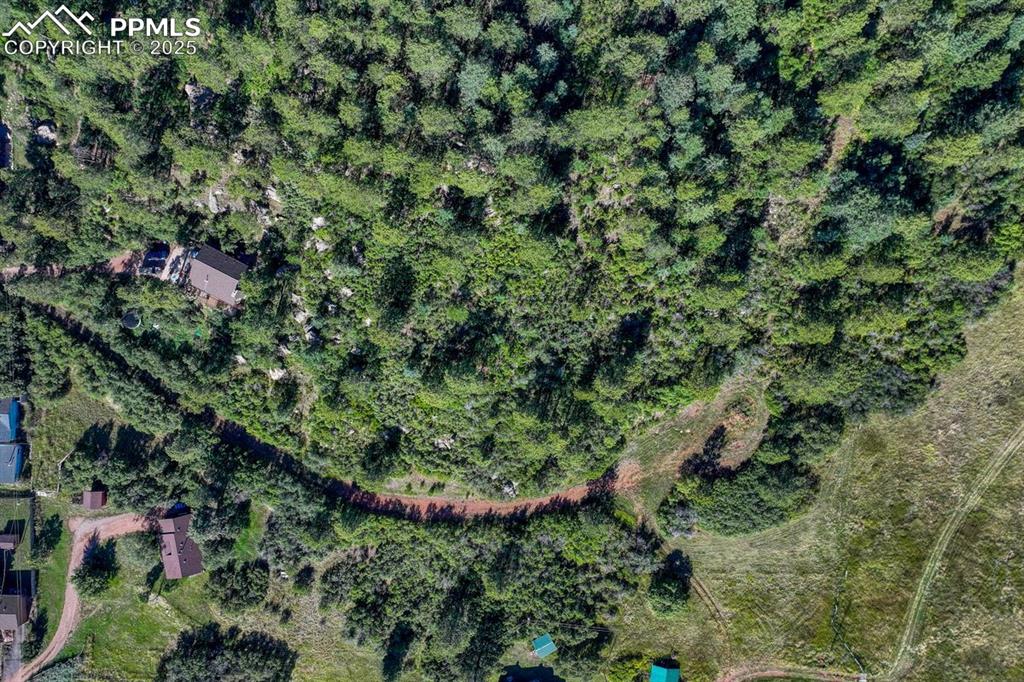 0 Columbine Road Palmer Lake, CO 80133 - Photo 32 of 37 an aerial view of residential house with outdoor space and trees all around