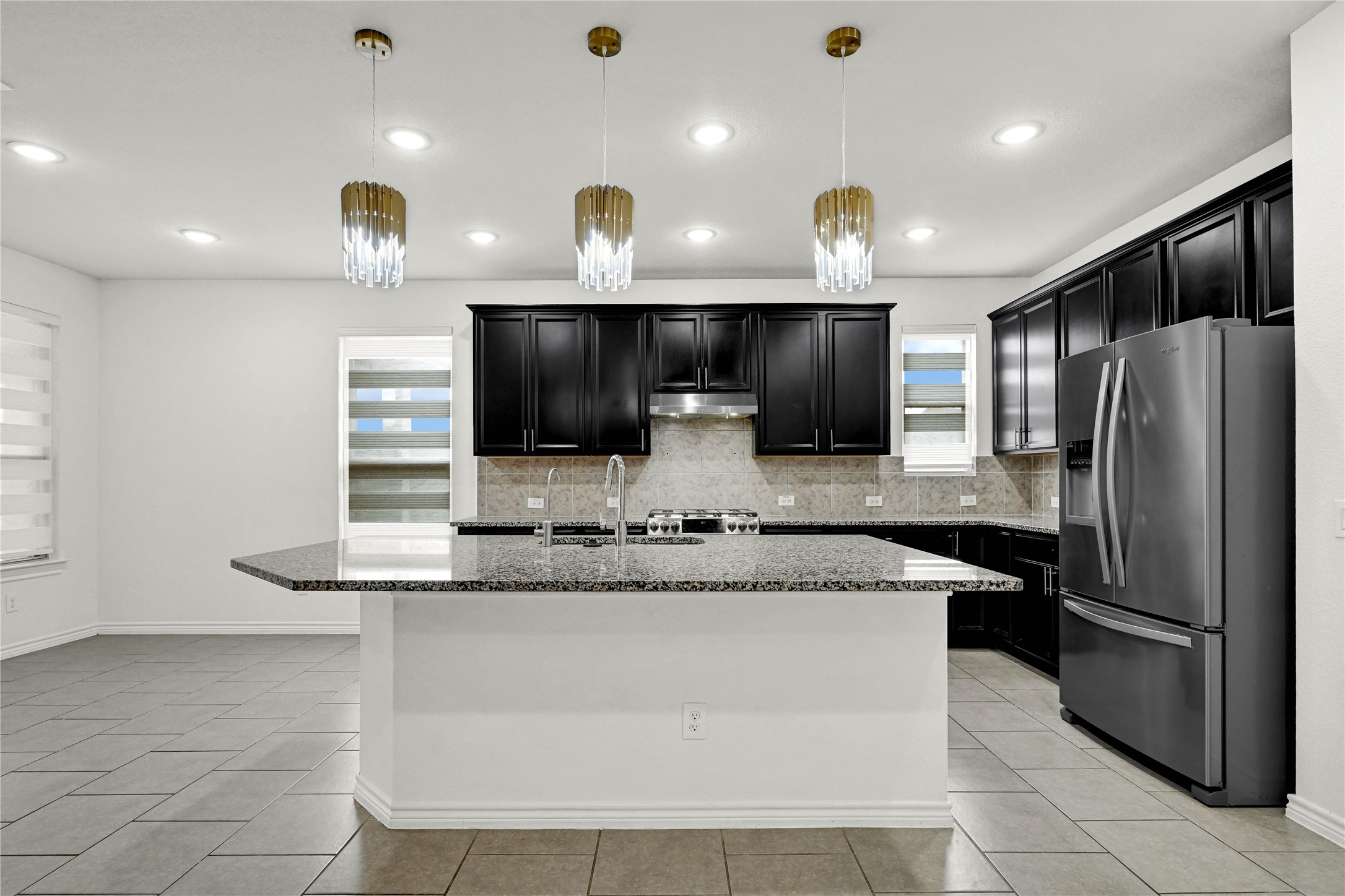 17802 Pepper Root Drive Spring, TX 77379 - Photo 12 of 34 a large kitchen with a large counter top stainless steel appliances and cabinets