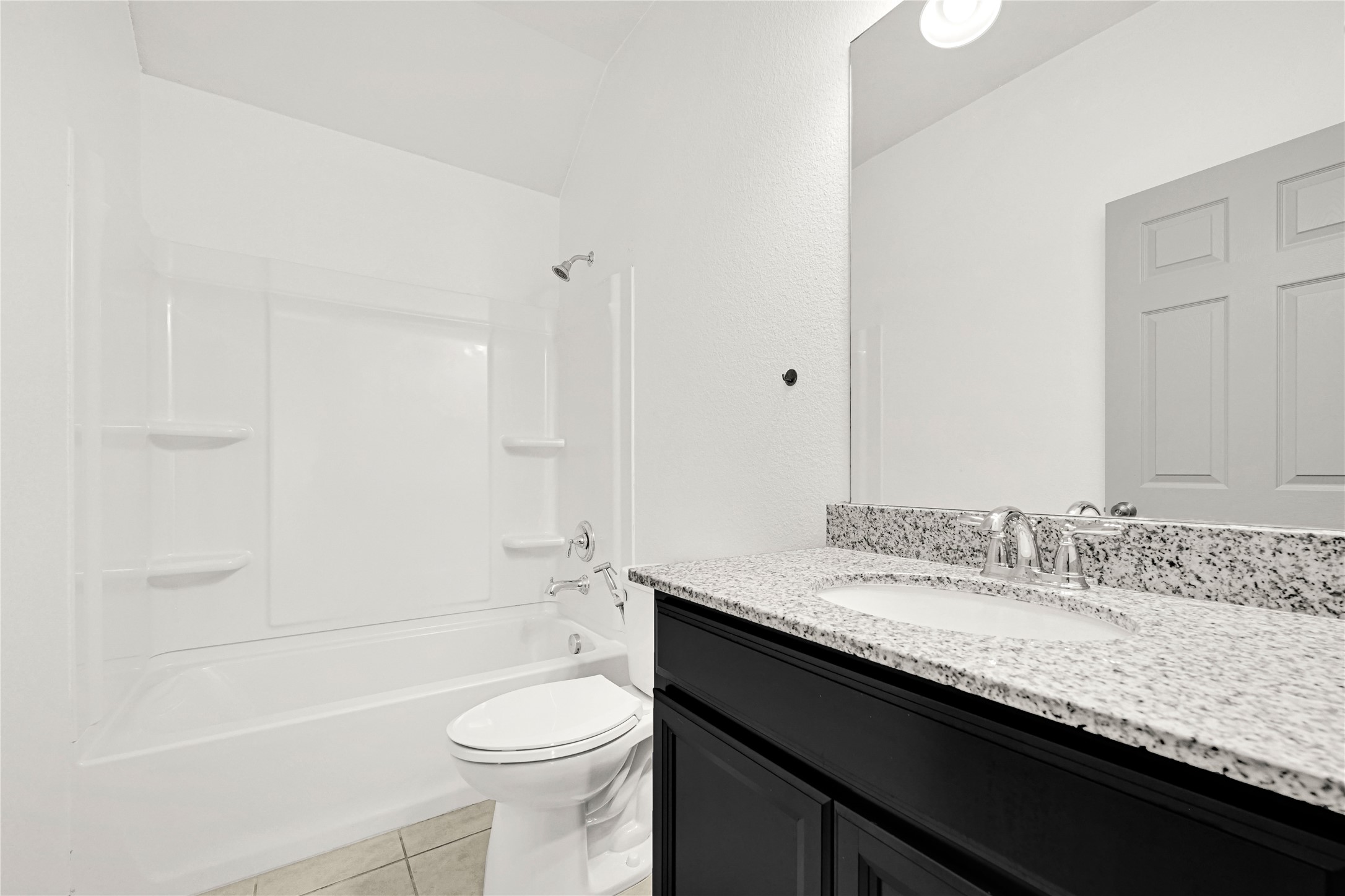 17802 Pepper Root Drive Spring, TX 77379 - Photo 32 of 34 a bathroom with a granite countertop toilet a sink and a bathtub