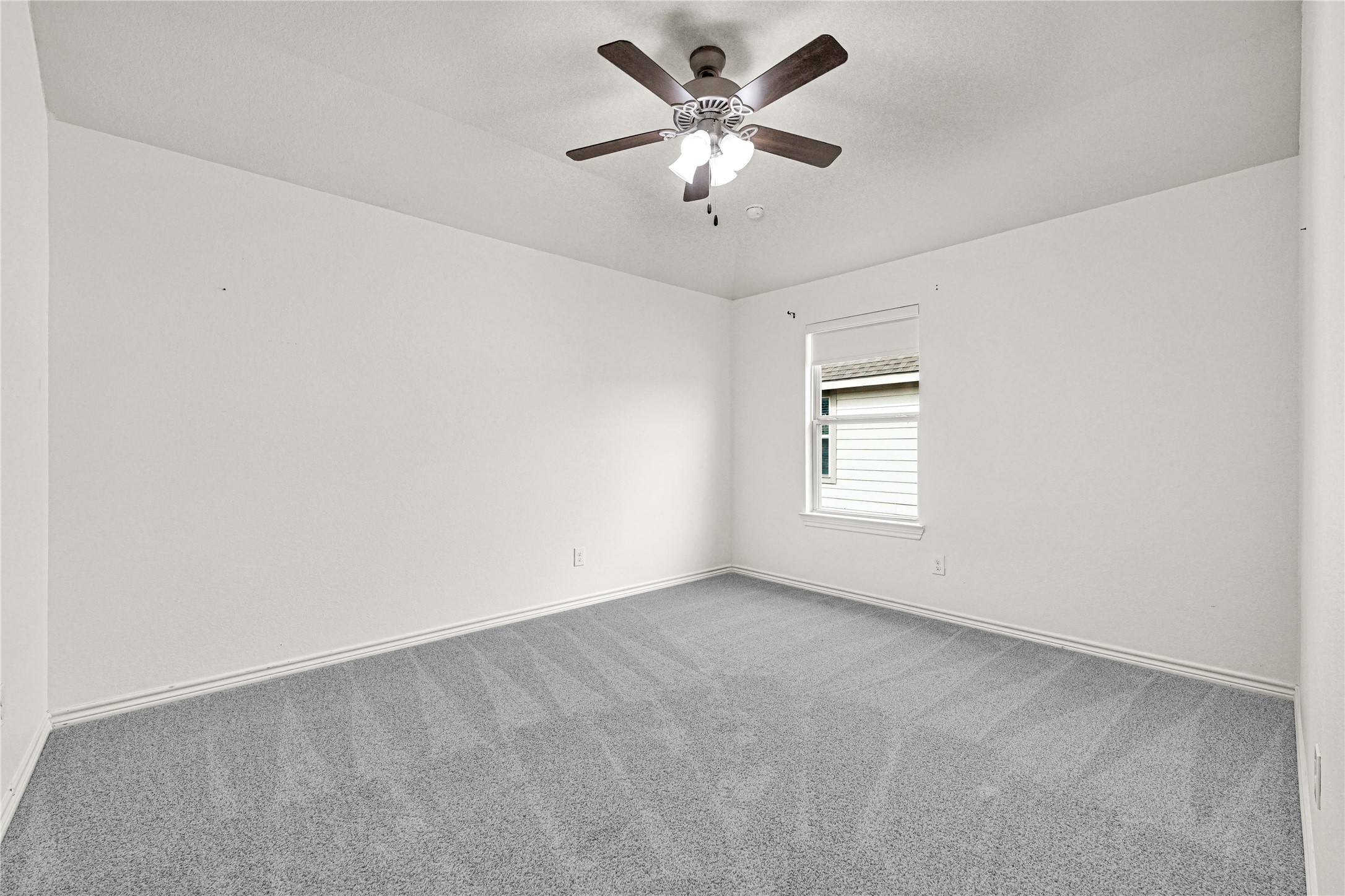 17802 Pepper Root Drive Spring, TX 77379 - Photo 33 of 34 an empty room with a window and a fan