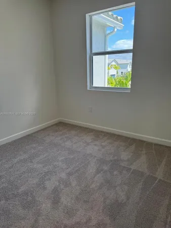 an empty room that has a window