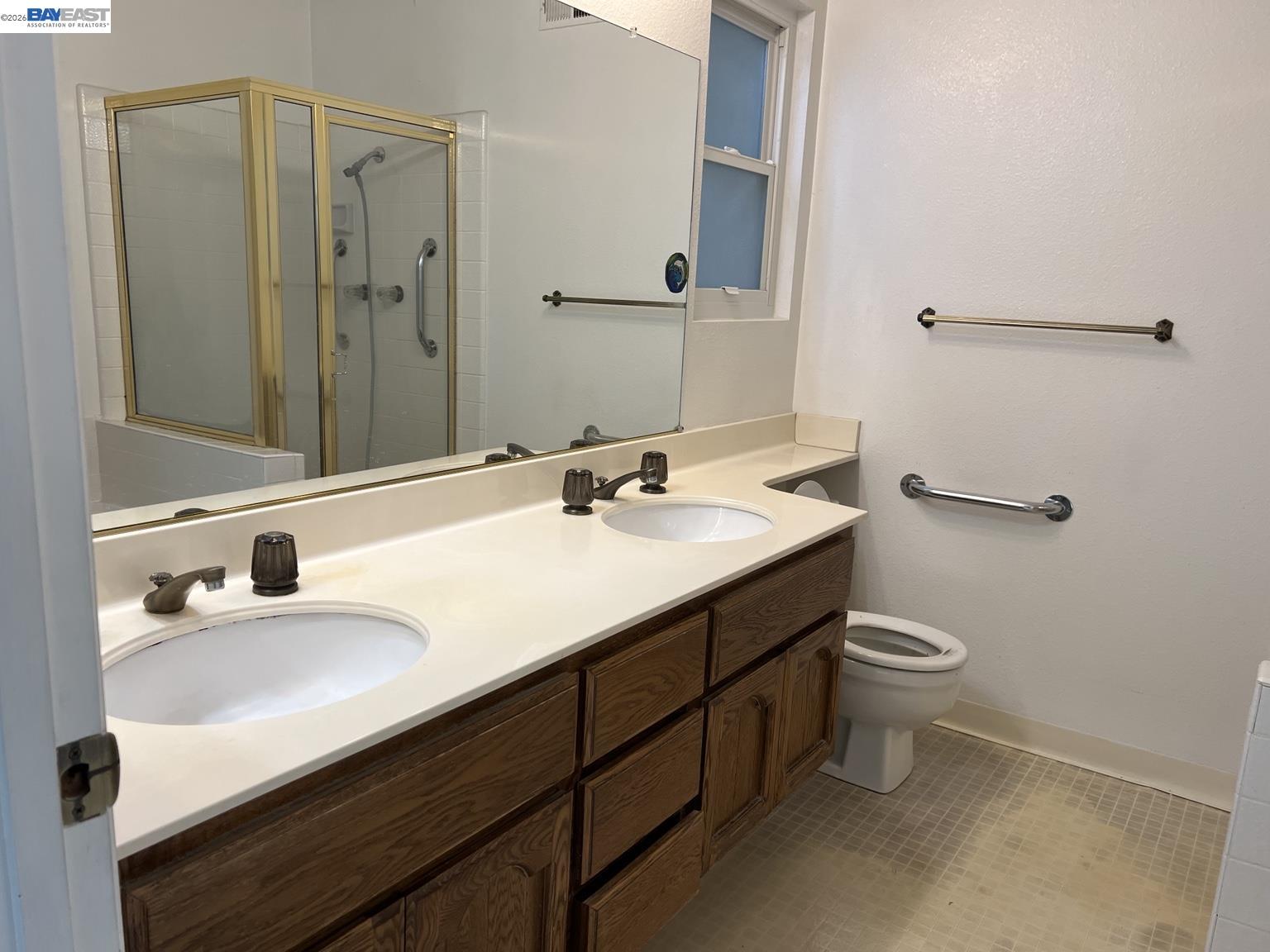 212 Puddingstone Road Alameda, CA 94502 - Photo 20 of 24 a bathroom with a sink and a mirror