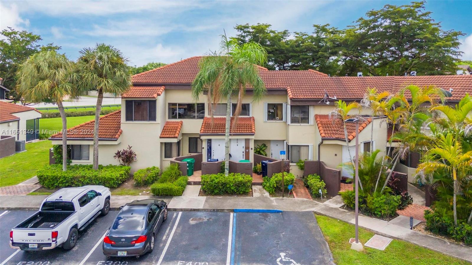 9823 Southwest 138th Avenue, Unit FC2L Miami, FL 33186 - Photo 1 of 28 a front view of a house with garden