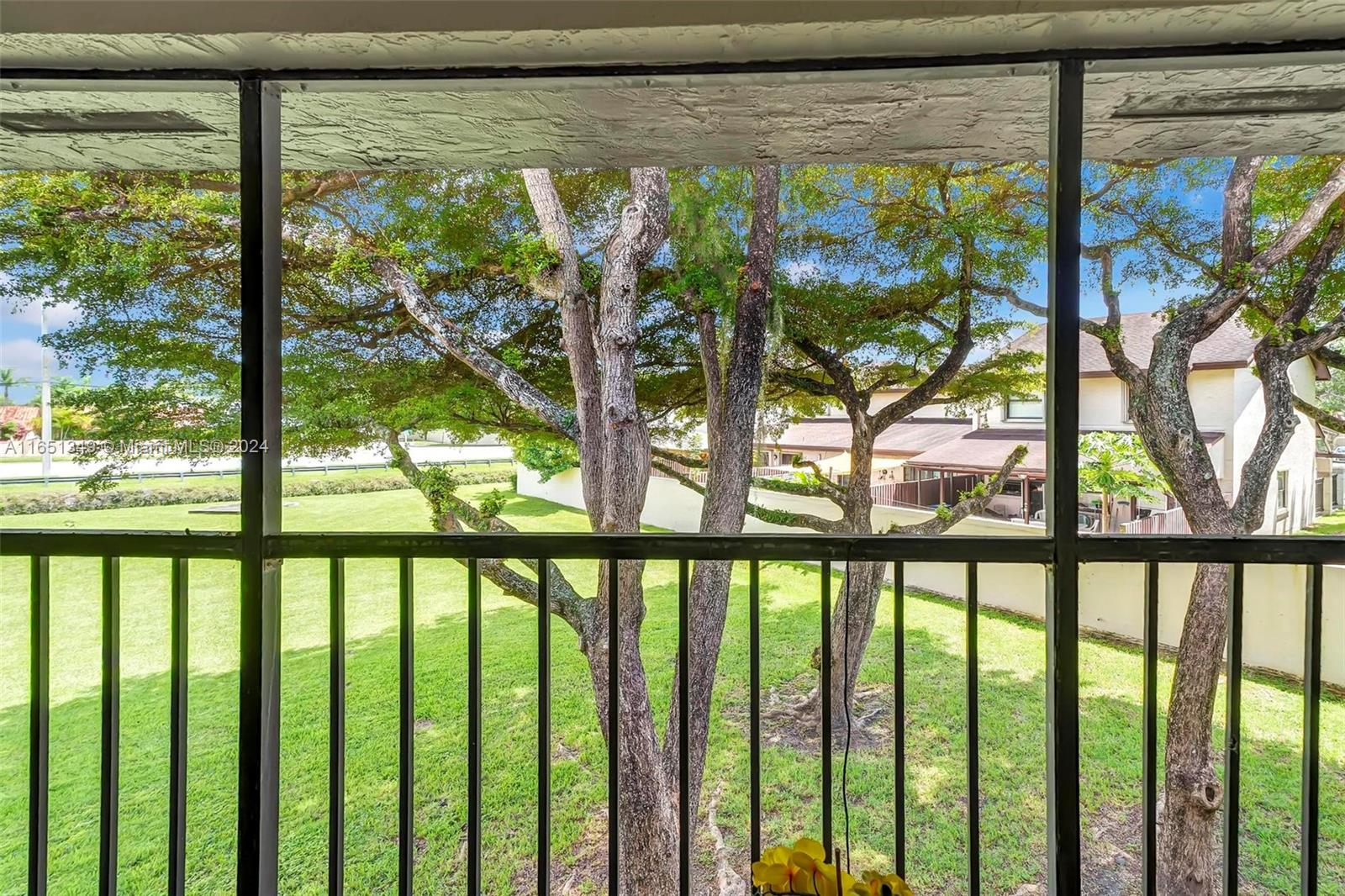 9823 Southwest 138th Avenue, Unit FC2L Miami, FL 33186 - Photo 14 of 28 a view of a porch