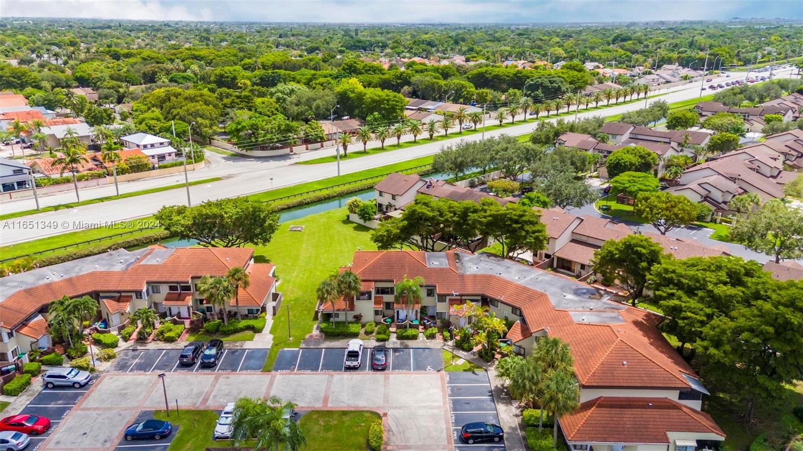 9823 Southwest 138th Avenue, Unit FC2L Miami, FL 33186 - Photo 20 of 28 an aerial view of lake and residential houses with outdoor space