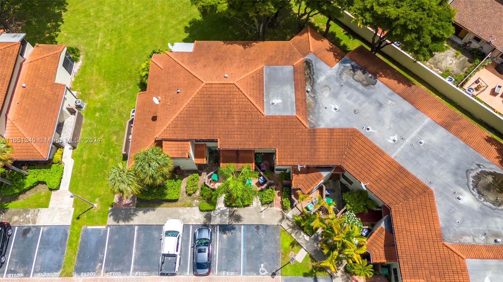9823 Southwest 138th Avenue, Unit FC2L Miami, FL 33186 - Photo 22 of 28 aerial view of a house with a yard and potted plants