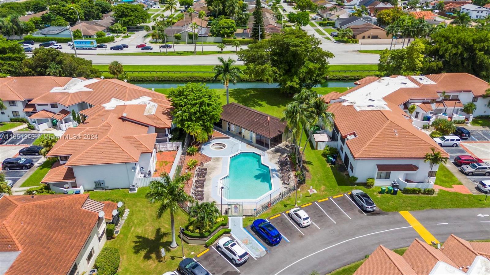 9823 Southwest 138th Avenue, Unit FC2L Miami, FL 33186 - Photo 25 of 28 an aerial view of a house with a garden and lake view