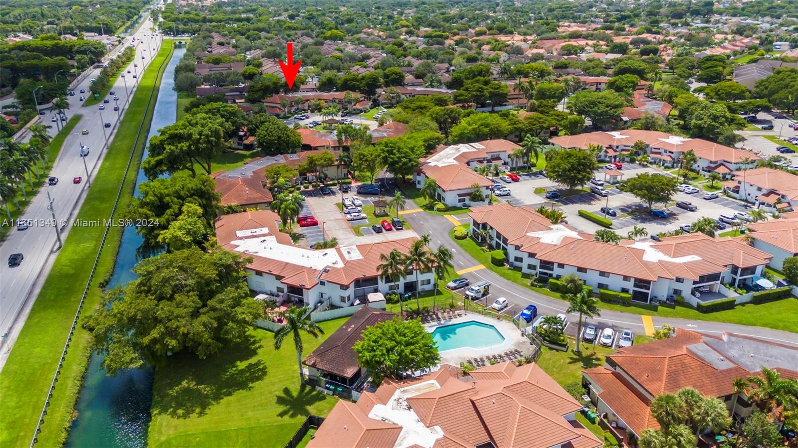 9823 Southwest 138th Avenue, Unit FC2L Miami, FL 33186 - Photo 26 of 28 an aerial view of residential houses with outdoor space and trees
