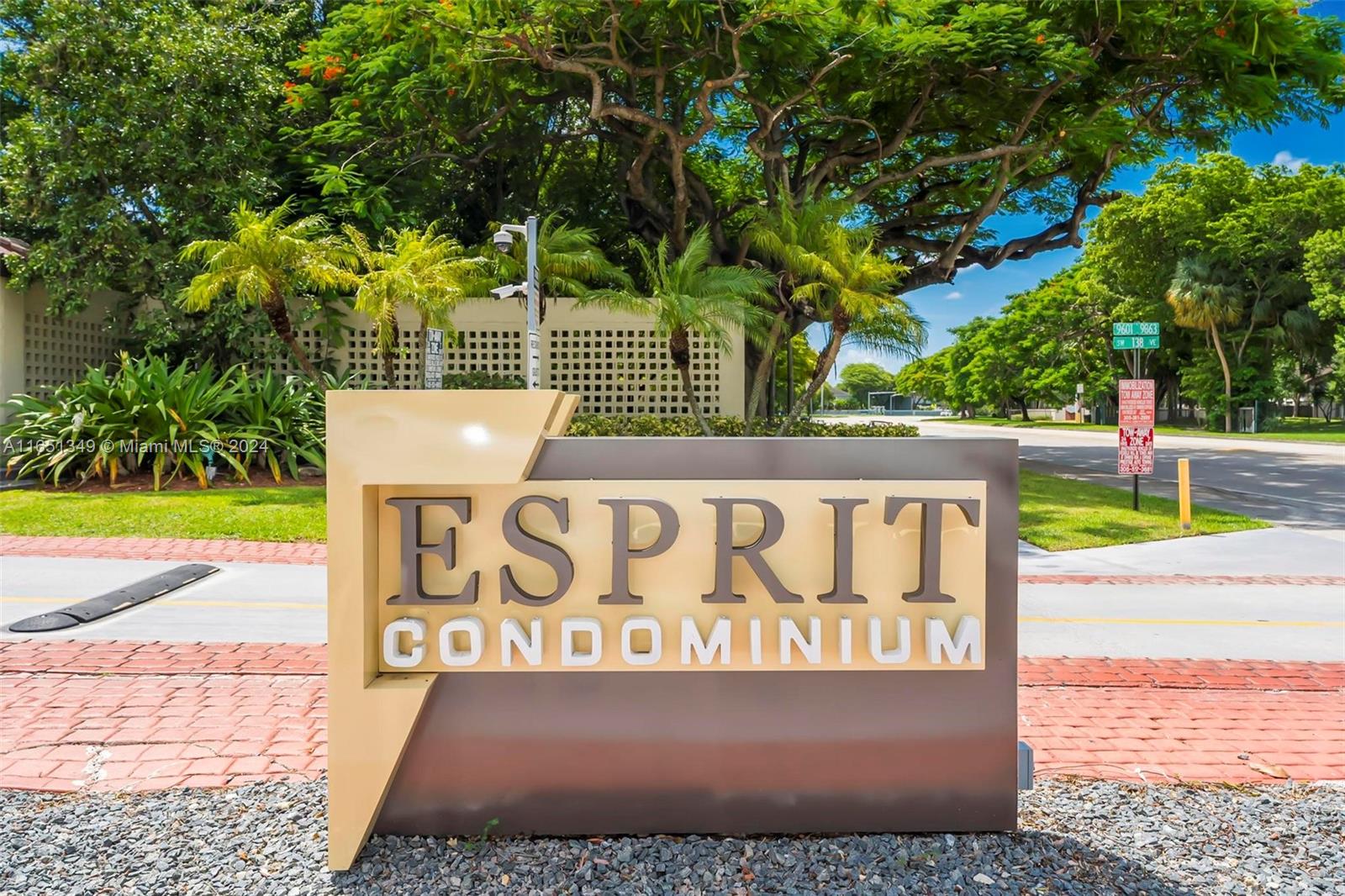 9823 Southwest 138th Avenue, Unit FC2L Miami, FL 33186 - Photo 28 of 28 a street sign that is sitting on a sidewalk
