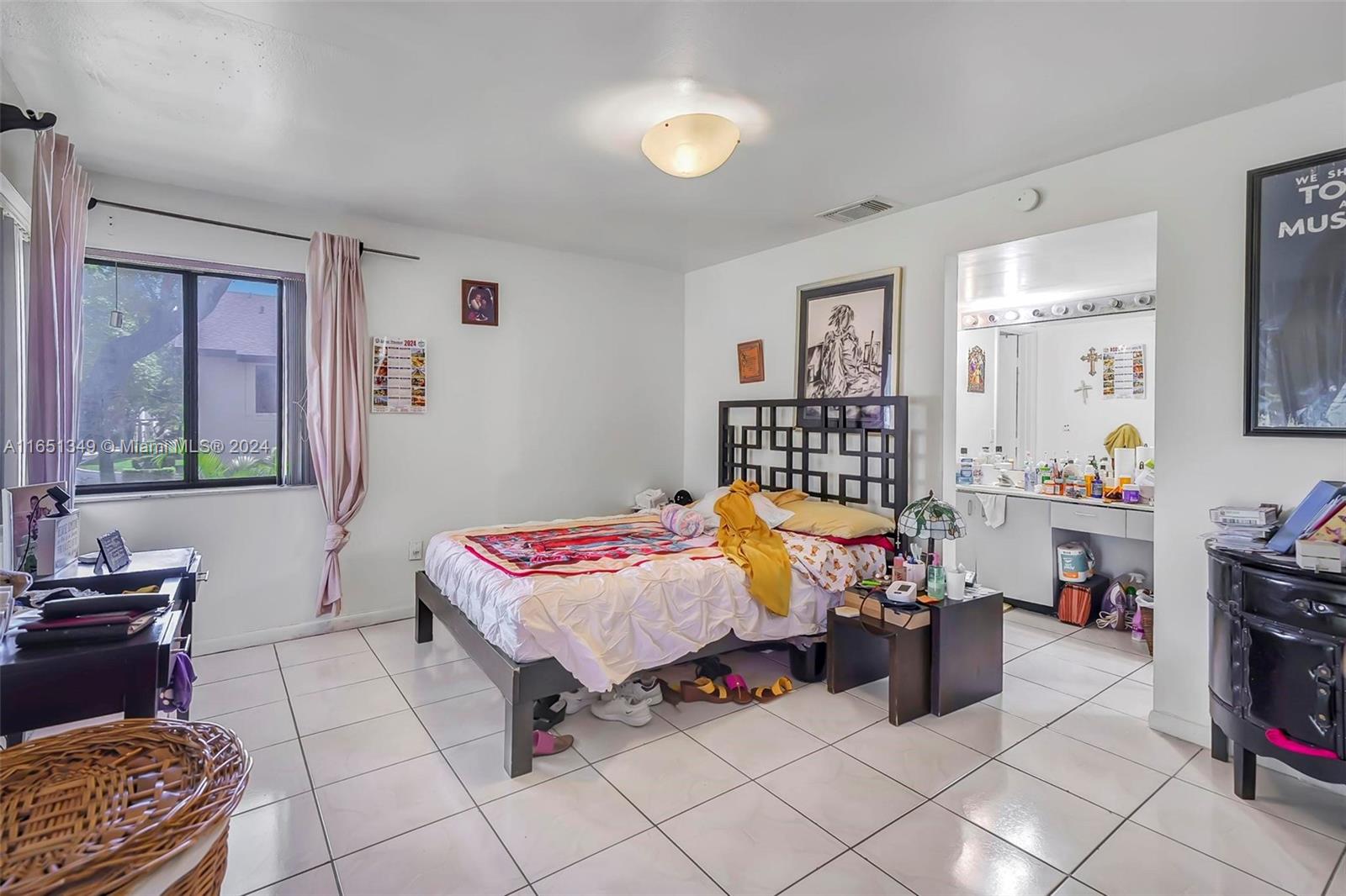 9823 Southwest 138th Avenue, Unit FC2L Miami, FL 33186 - Photo 9 of 28 a bedroom with furniture and a window