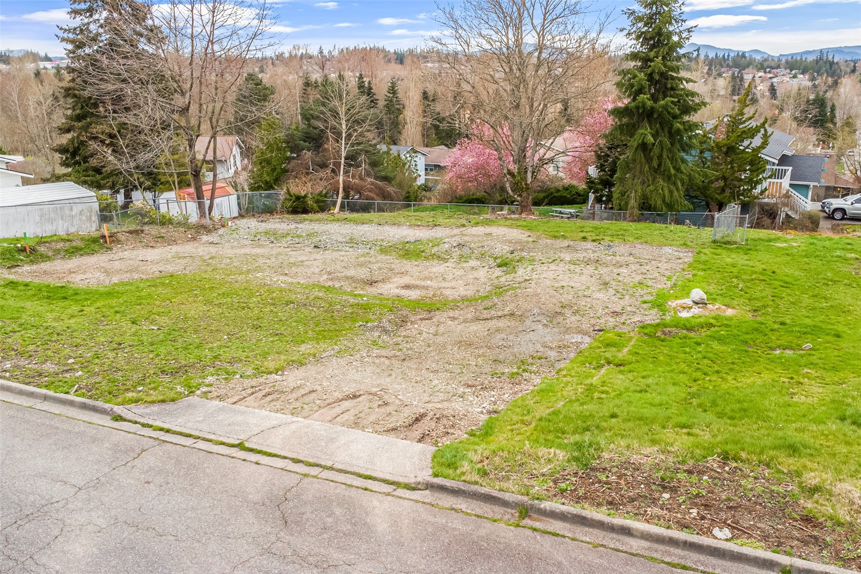 a backyard of apartments with large trees