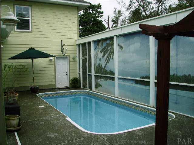 10688 Squall Line Road Pensacola, FL 32507 - Photo 23 of 24 Pool. The door in the background leads to the guest suite above the garage.