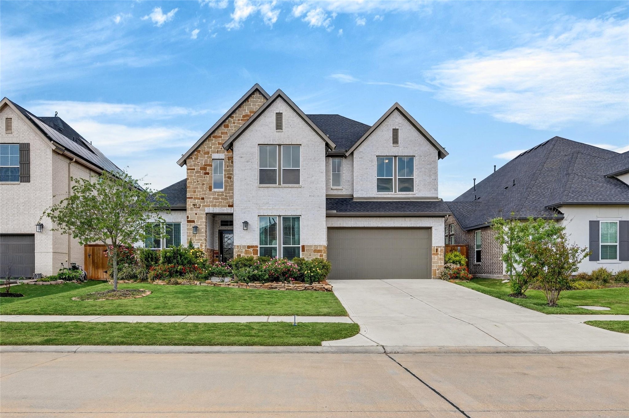 32018 Crested Knl Court Fulshear, TX 77441 - Photo 1 of 50 a front view of a house with a yard