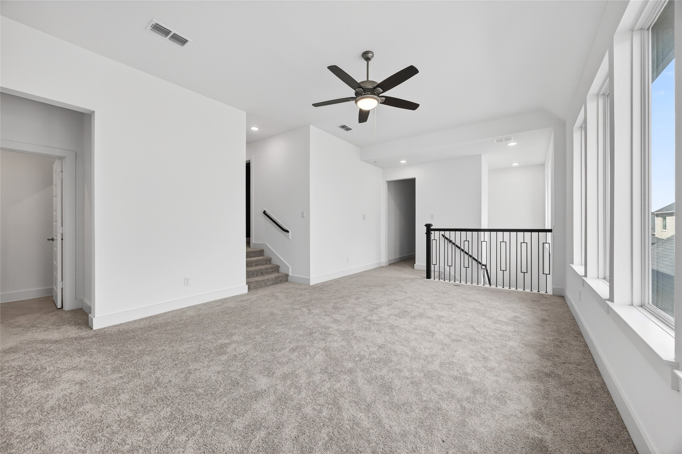 32018 Crested Knl Court Fulshear, TX 77441 - Photo 27 of 50 a view of a livingroom with a ceiling fan and window