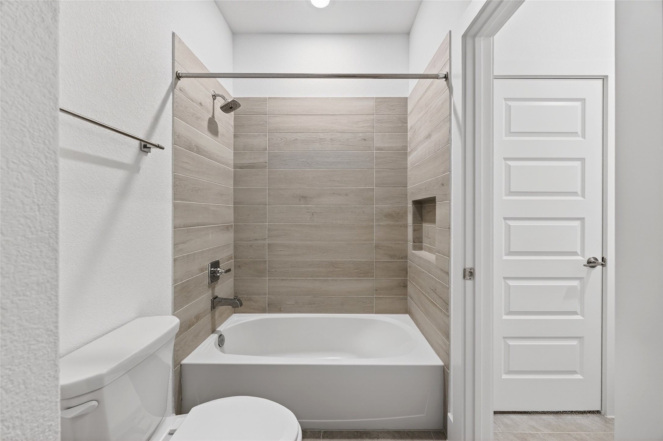 32018 Crested Knl Court Fulshear, TX 77441 - Photo 36 of 50 a bathroom with a shower and a bath tub
