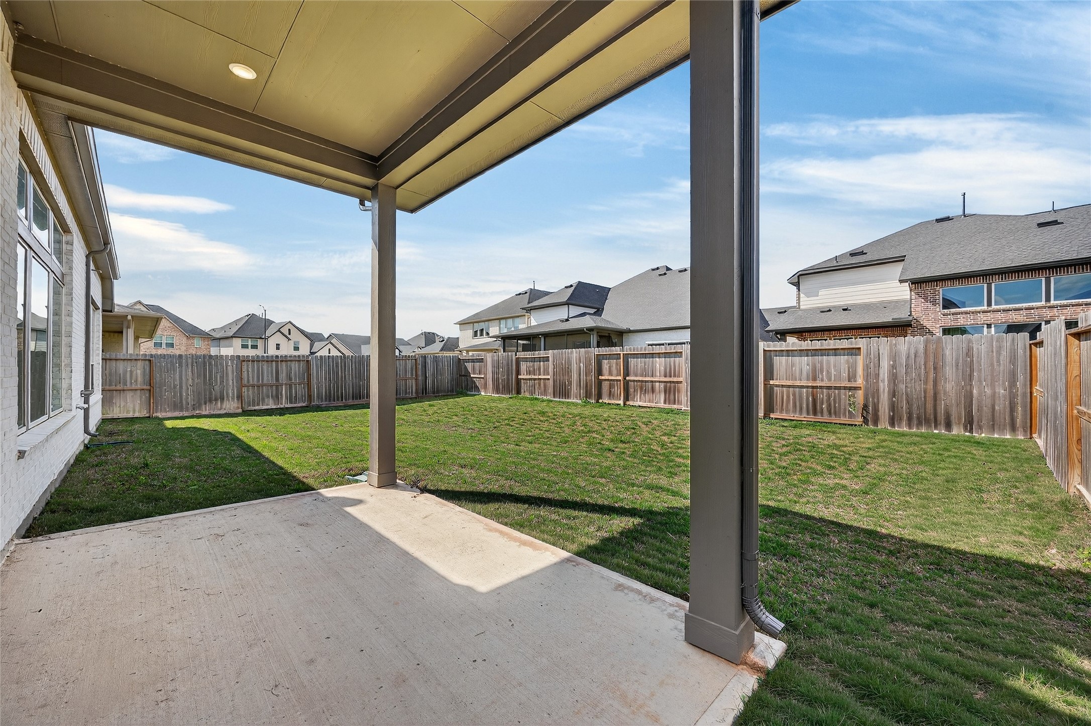 32018 Crested Knl Court Fulshear, TX 77441 - Photo 46 of 50 a view of a house with a big yard and potted plants