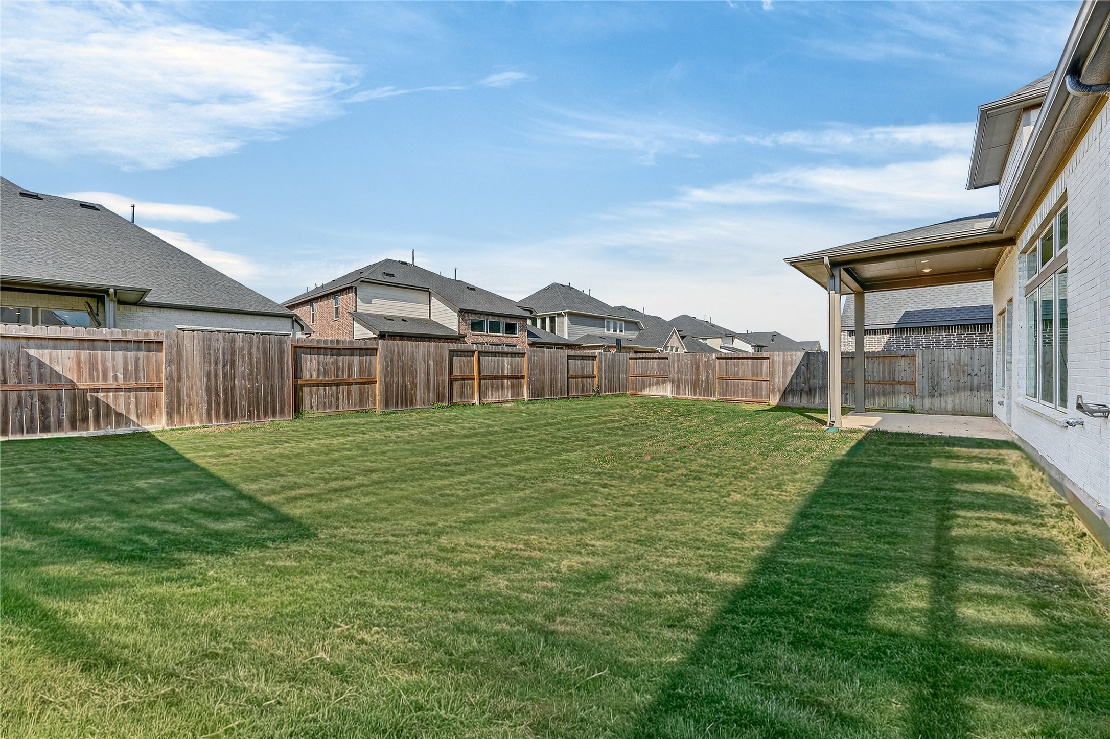 32018 Crested Knl Court Fulshear, TX 77441 - Photo 47 of 50 a front view of a house with a garden