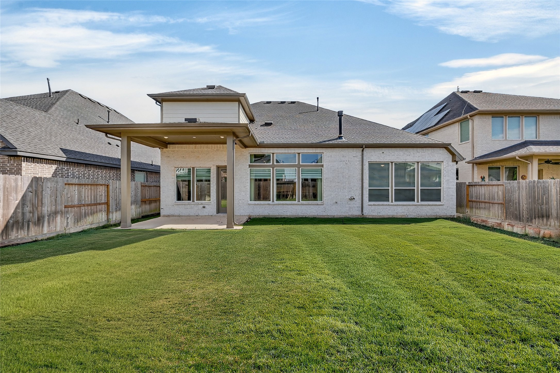32018 Crested Knl Court Fulshear, TX 77441 - Photo 48 of 50 a front view of a house with a garden