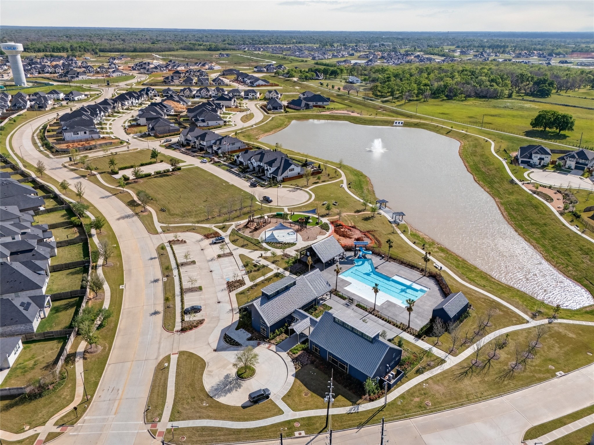 32018 Crested Knl Court Fulshear, TX 77441 - Photo 50 of 50 an aerial view of a swimming pool with a mountain view