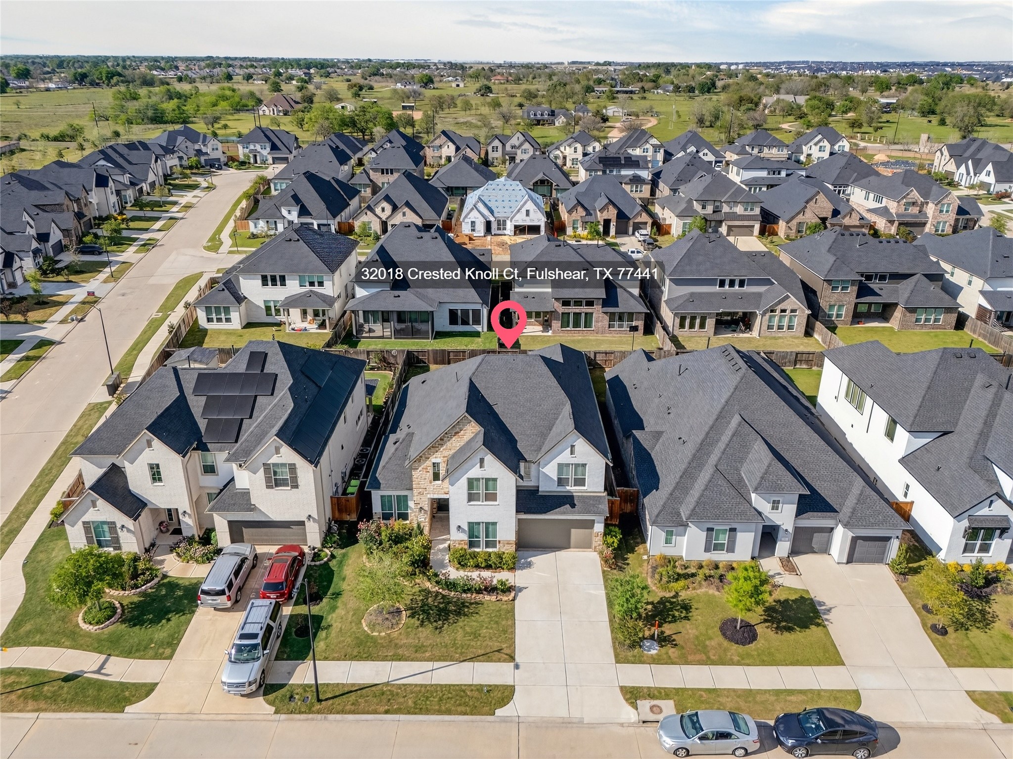 32018 Crested Knl Court Fulshear, TX 77441 - Photo 5 of 50 an aerial view of houses with outdoor space