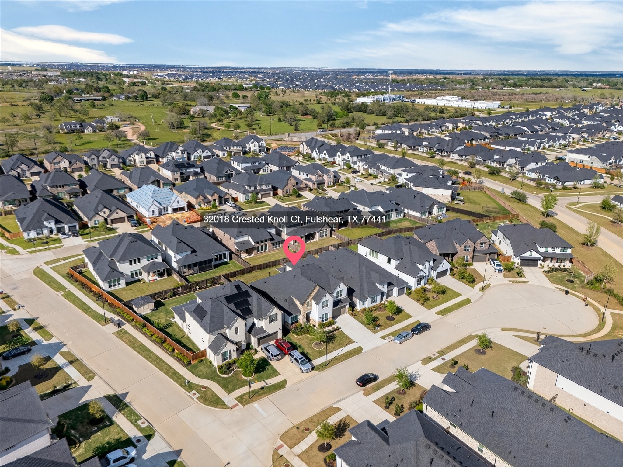 32018 Crested Knl Court Fulshear, TX 77441 - Photo 6 of 50 an aerial view of residential building and lake