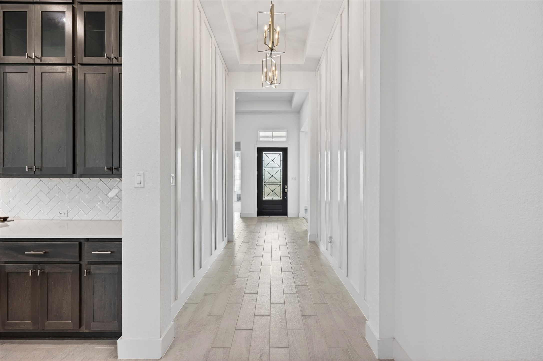 32018 Crested Knl Court Fulshear, TX 77441 - Photo 9 of 50 a view of a hallway with wooden floor and staircase
